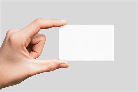 hand holding standard business card